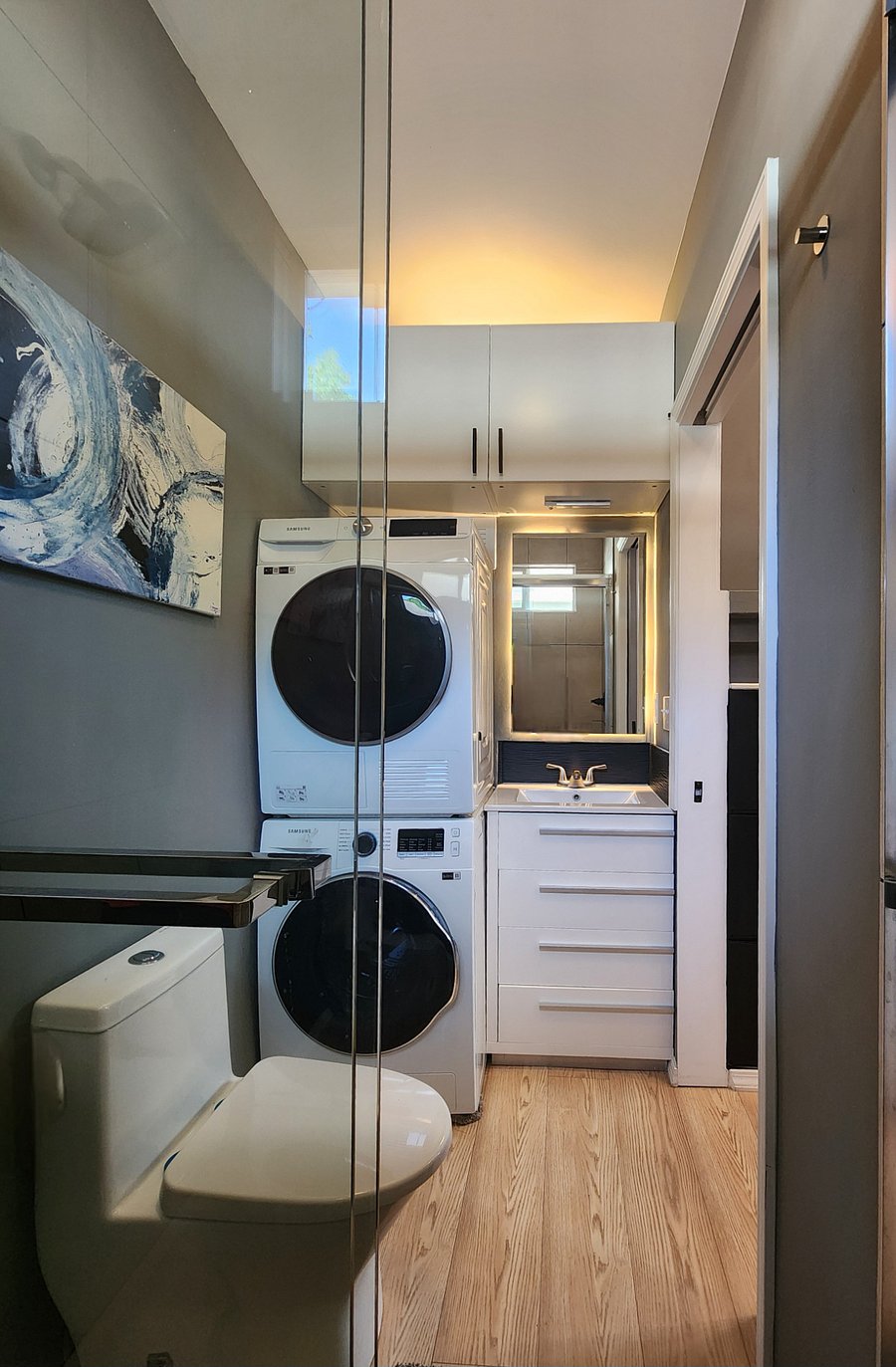 In unit washer and dryer included, mirror cabinet for extra storage.