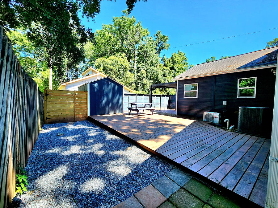 Private additional deck featuring a movable picnic table, perfect for relaxing outdoors!