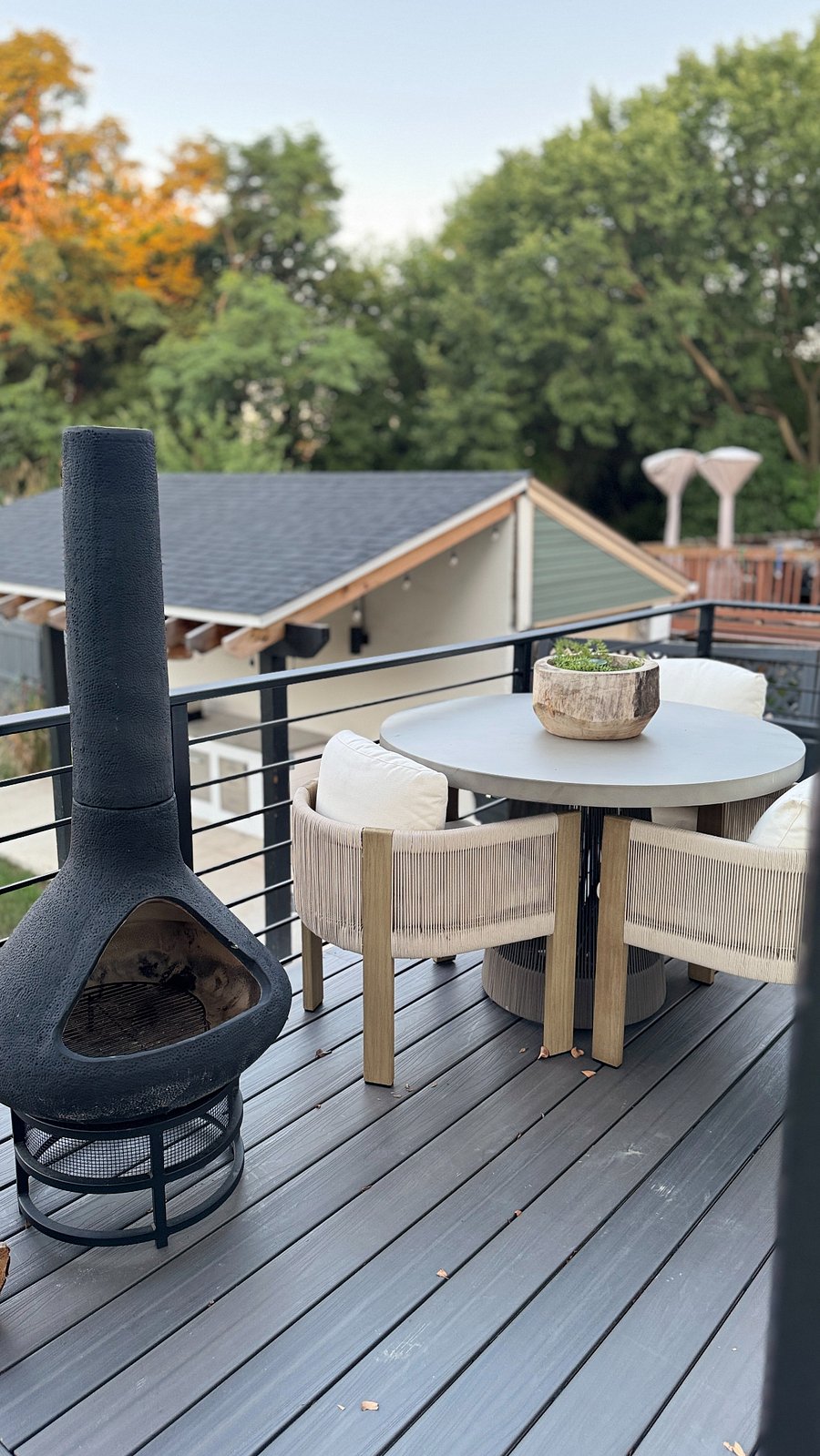 Outdoor patio dining table and chairs and fireplace