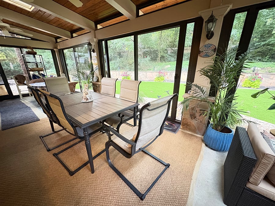 Cozy sunroom- offers another place to dine