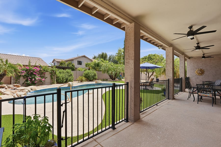 Covered patio with fans, misters, dining and lounging space.