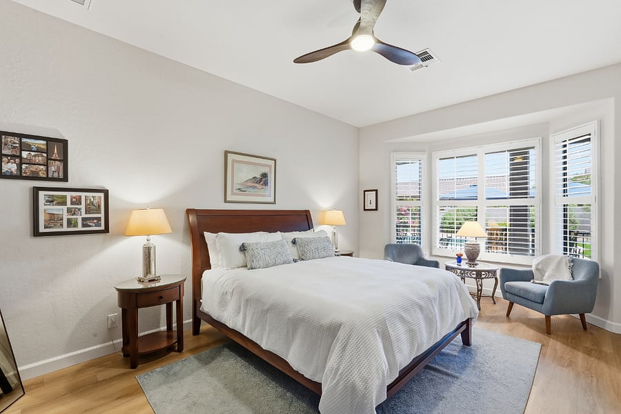 Primary bedroom with King sized bed and sitting area. Linens provided.