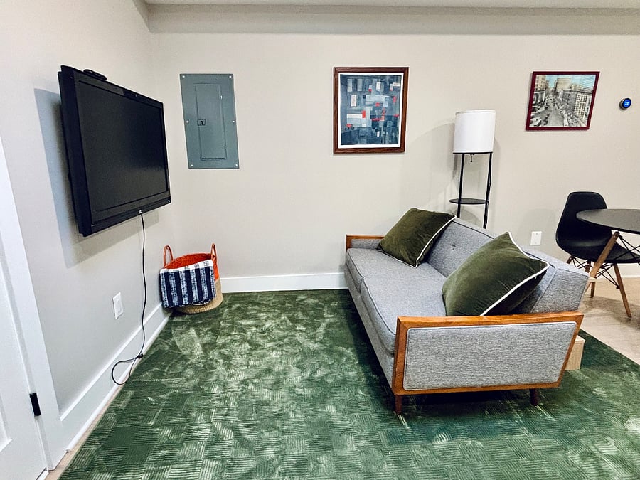 Living area with loveseat and smart TV