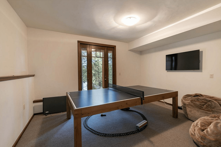 Lower level bonus room with ping-pong table and access to back yard