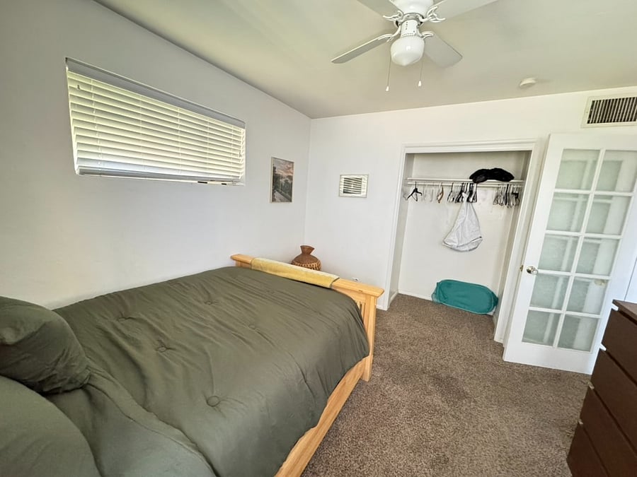 Full bedroom with closet and a dresser