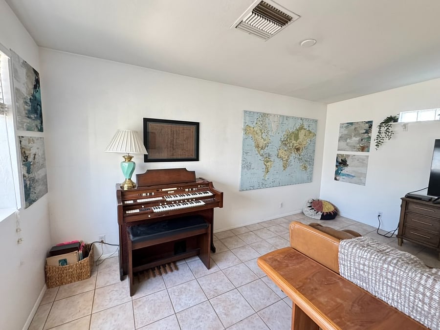 Fun, antique decor is all around the house, including this vintage organ!