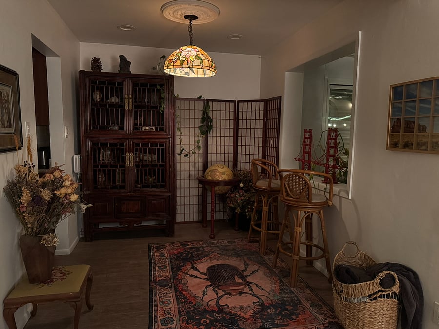Mid-century details abound, such as this Tiffany-style chandelier lamp