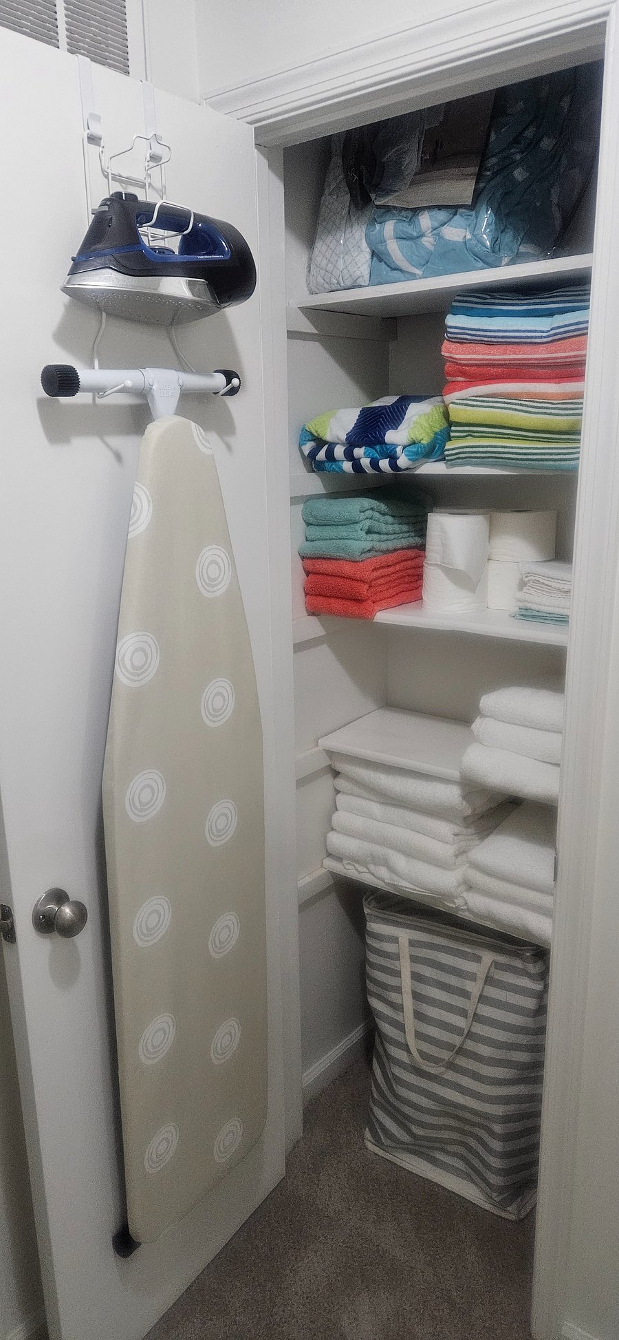 Closet w/Ironing Board and Toiletries
