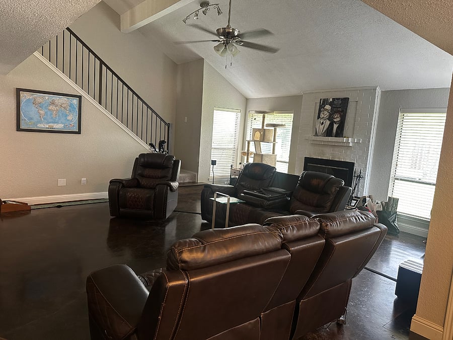 Living room w leather recliner and fireplace