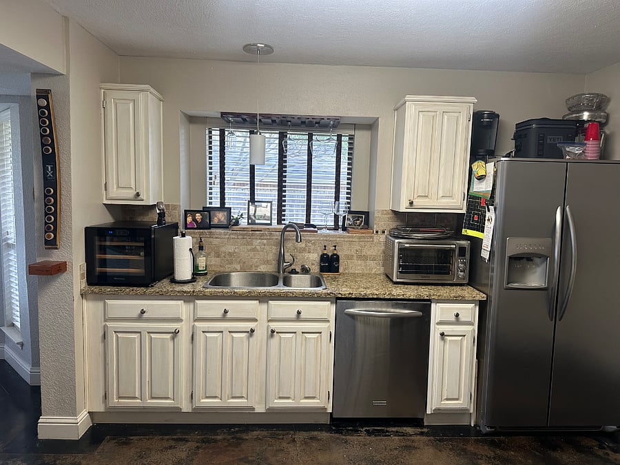 Kitchen w wine cooler and vitamix blender and stainless steel fridge