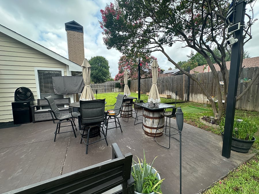 TX whiskey barrels turned into tables with umbrella patio canopy