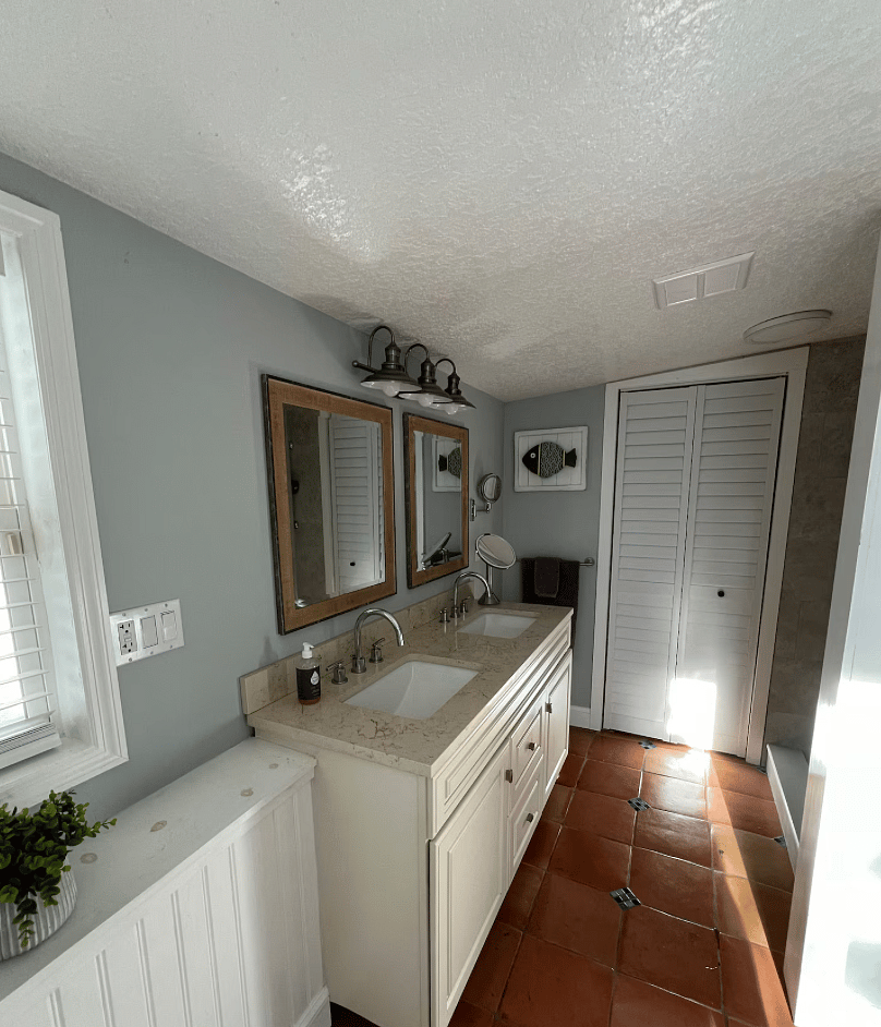 Master Bath (laundry loom is behind the plantation doors)