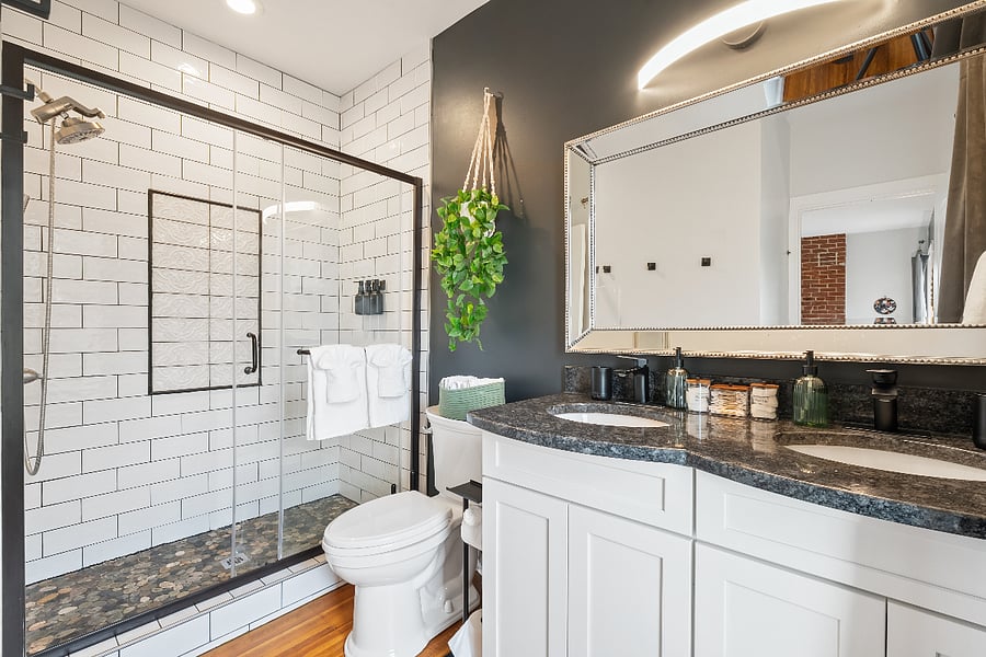 En-suite bathroom with luxury finishes and double sink.
