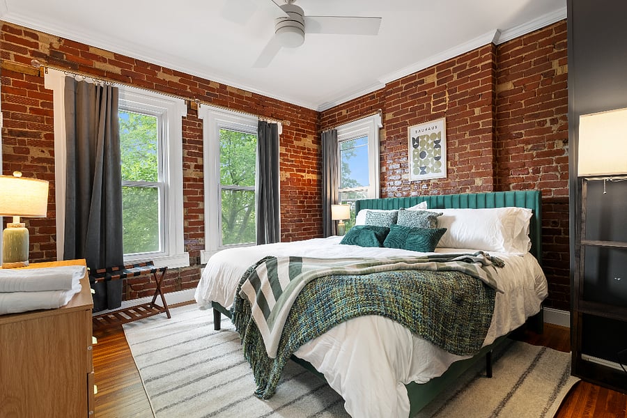 2nd floor bedroom with king size bed and closet.