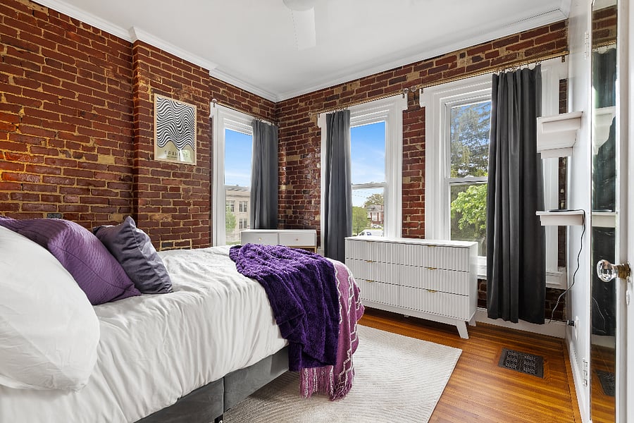 3rd bedroom with king size bed, desk and closet.