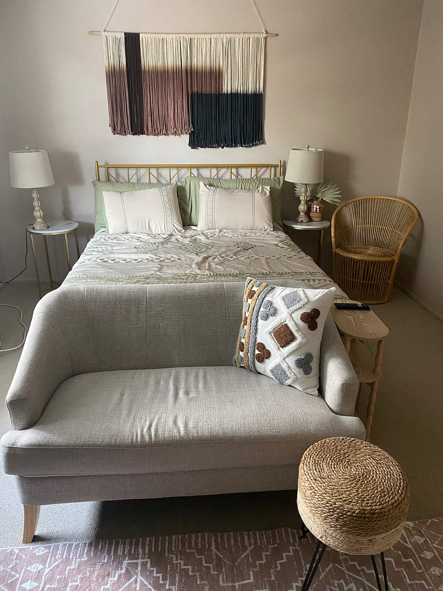 Queen size bed, loveseat, reading nook.