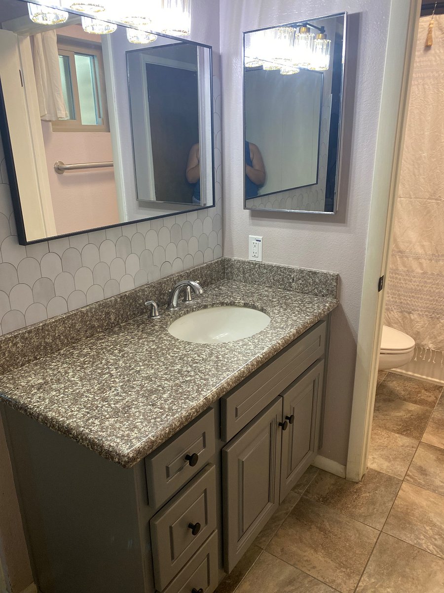 Sink area separated from tub and toilet. Lots of storage!