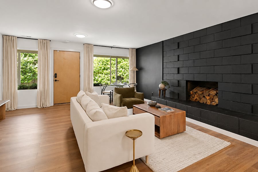 Relax in the spacious living area featuring a cozy decorative fireplace, curated local guidebooks, board games, and thoughtful touches to help you settle in.