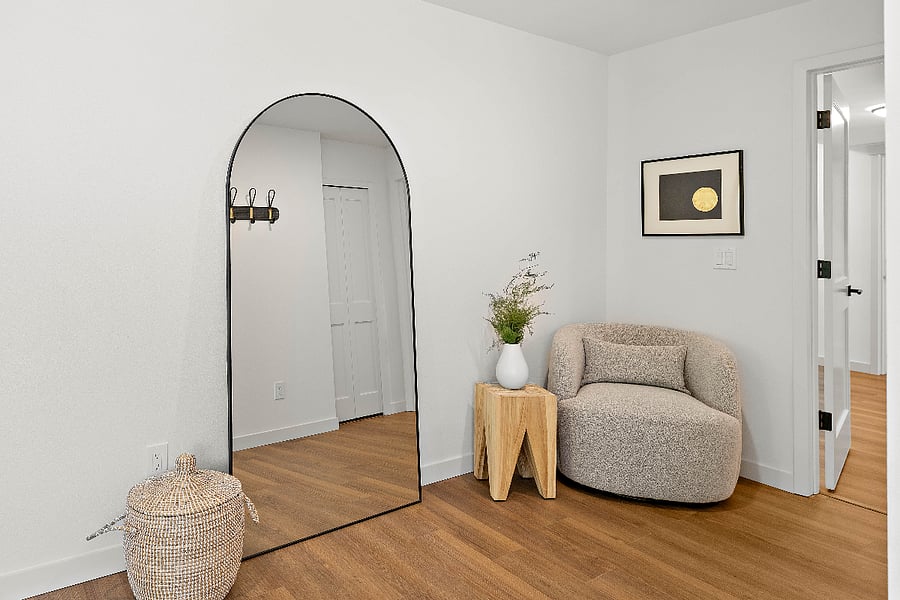 Bedroom reading nook and extra large standing mirror.
