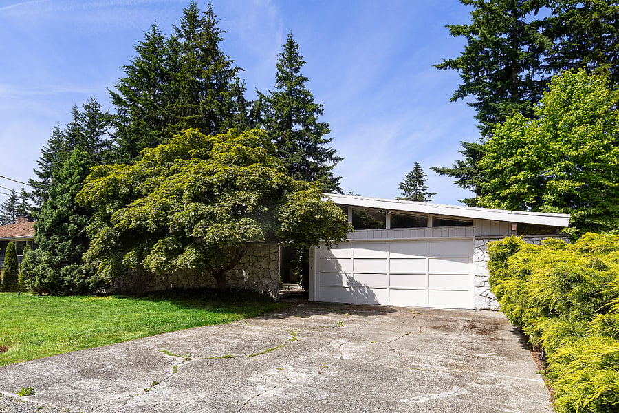 Front of house. Separate rental entrance is through a path to the right.