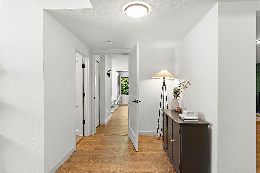 Hallway - door to the left is the bathroom, straight ahead is the bedroom. Office is in this hallway. Opening to the right is the living room and kitchen.