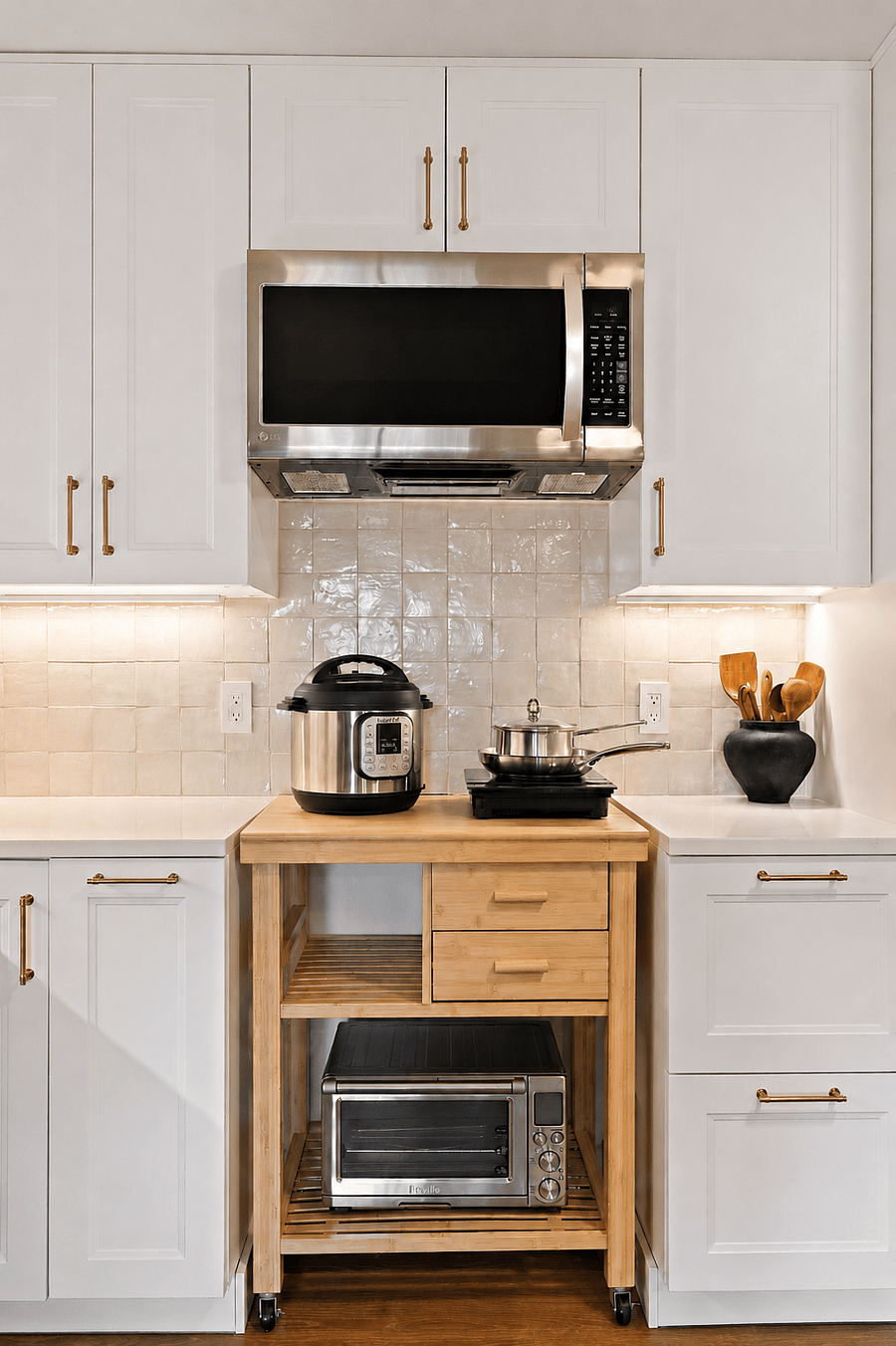 Dedicated cooking station with a countertop convection oven/air fryer, 2 induction cooktops, Instant Pot, blender, microwave, cookware, and utensils - everything you need to prepare meals during your stay.