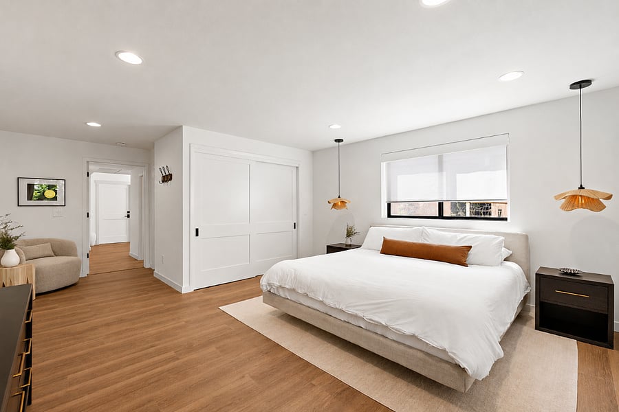 Bright, airy bedroom with ample storage and a comfortable king bed.