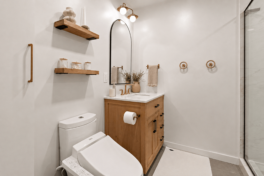 Modern bathroom with a heated Japanese bidet toilet, hair dryer with diffuser, hair straightener & curler, ample storage, spacious vanity, and plush towels. All lights can be adjusted for dim relaxation, or for a bright wakeup!