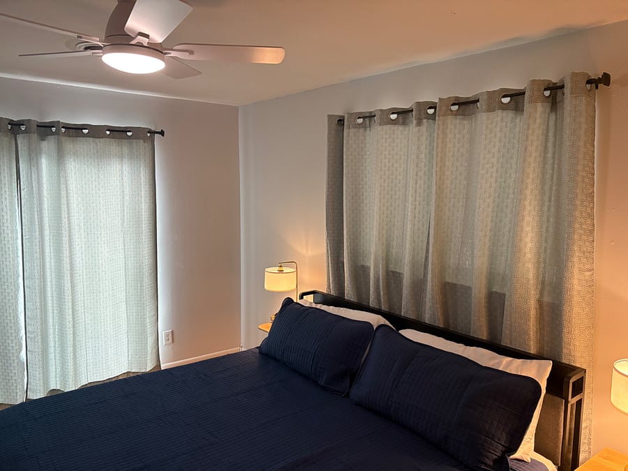 Primary bedroom features a cozy and comfortable king-size