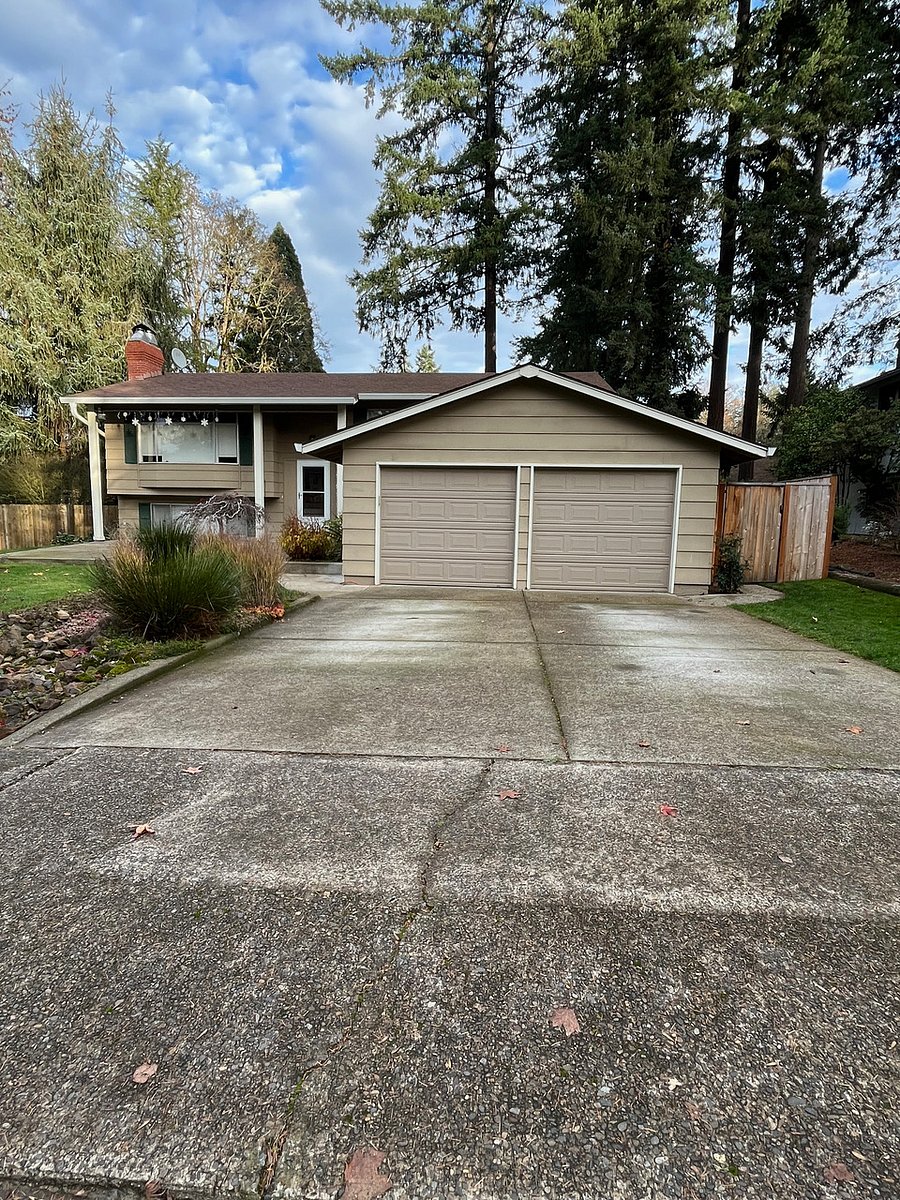Designated parking on right side of driveway. Keyless gate entrance on the right side of garage.