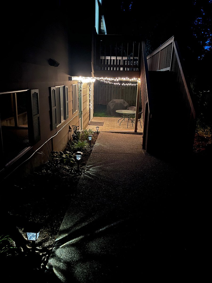 Nighttime walkway view to entrance