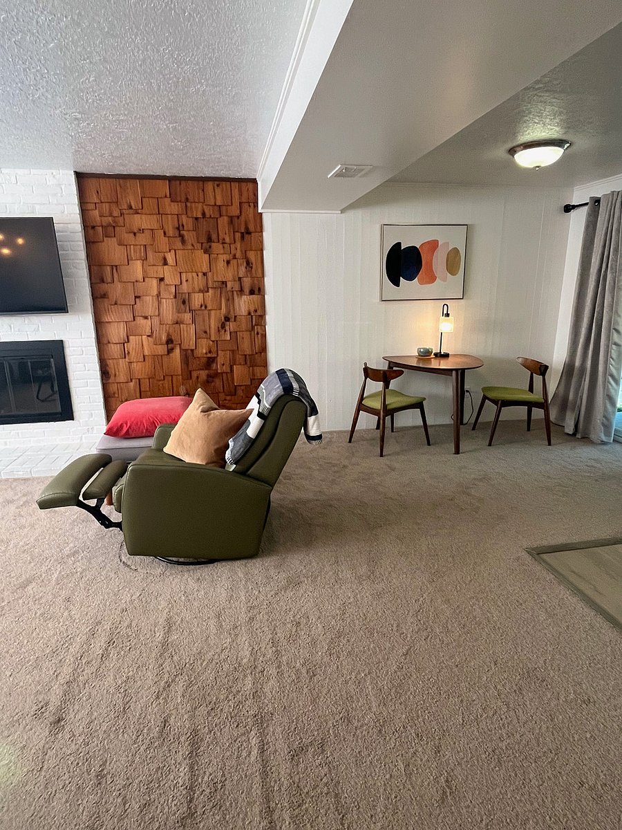 Open living/dining area with leather
swivel rocking recliner.