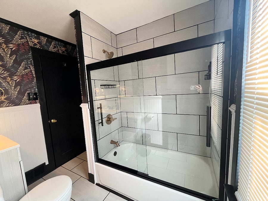 Brand new porcelain tiled shower with Delta faucet and soaking tub