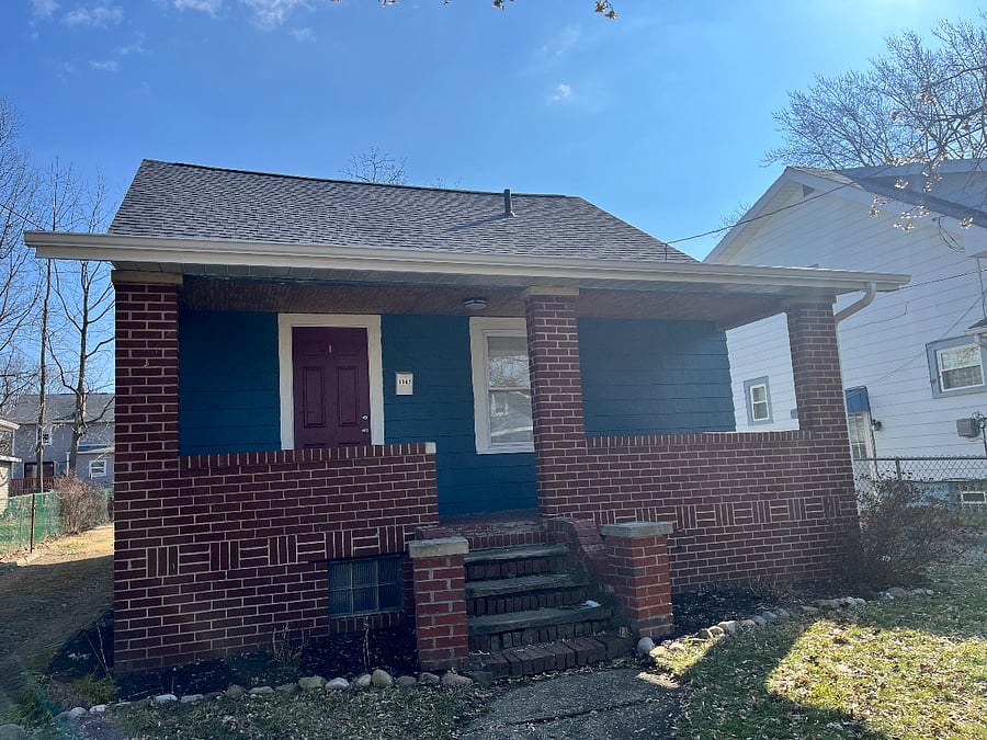 Freshly painted exterior with brick front porch