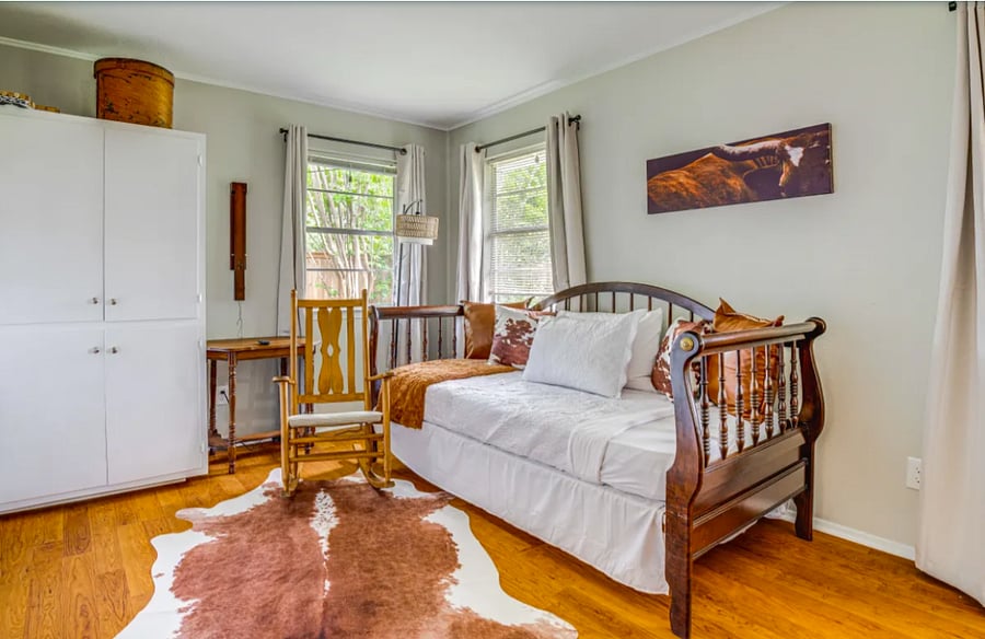 Twin bed with another twin trundle located in multi-purpose room