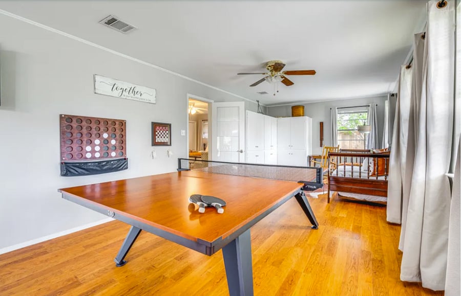 Multi-purpose room featuring ping pong table, connect four, chess and checkers games