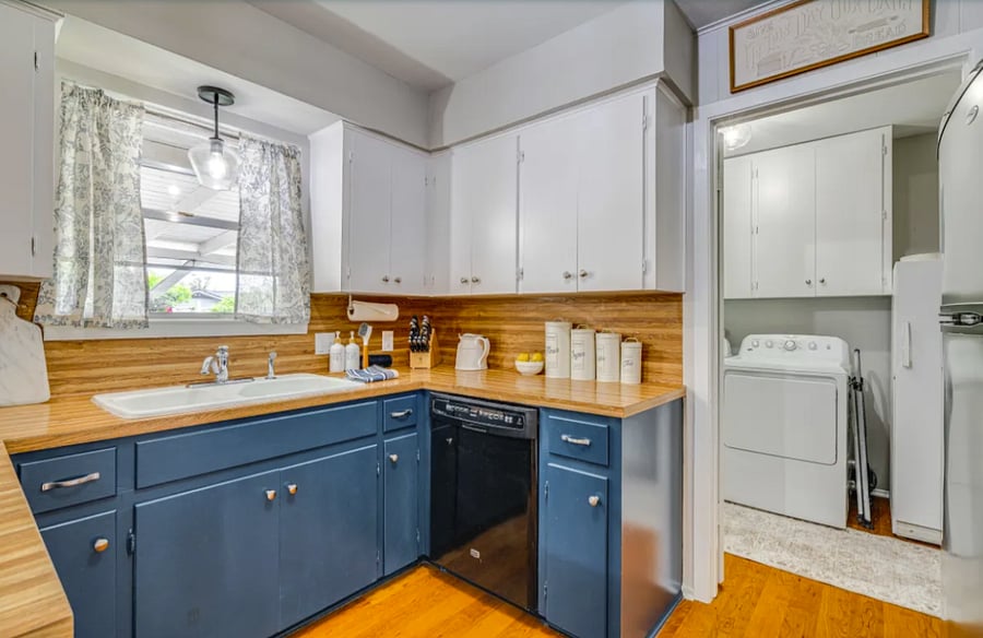 Kitchen featuring with double sink and garbage disposal.
