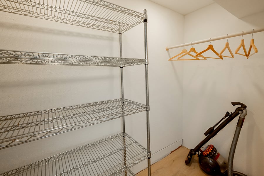 Roomy hall closet with coat hanger space and plenty of storage