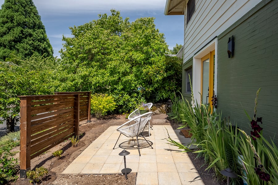 Outside patio with furniture and landscape lighting
