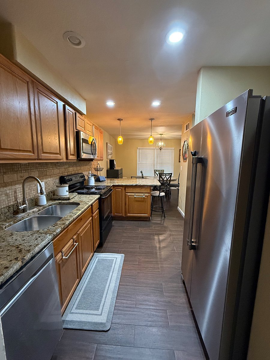 Kitchen with Granite Countertops, and Appliances