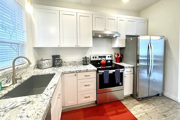 Fully stocked kitchen and dining areaperfect for meals in or casual gatherings!