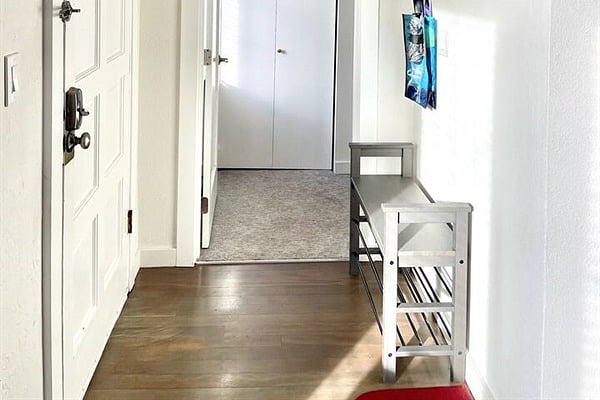 Main entrance and hall to main level queen guest room