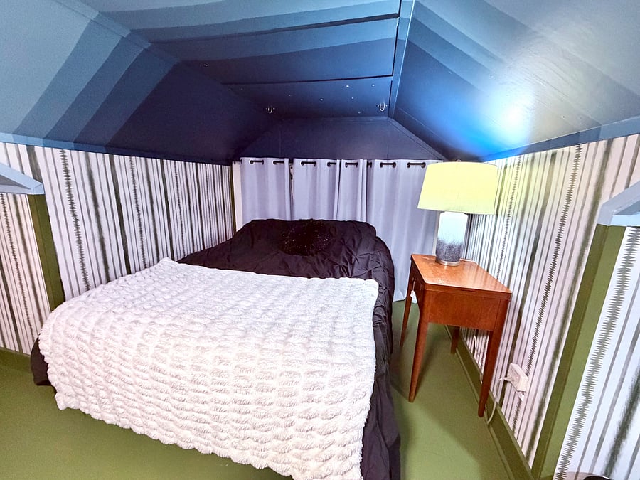 Upstairs/2nd floor bedroom includes a queen bed, sofa, tv, walk-in closet and more!
