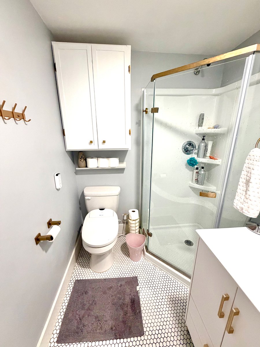 Primary bath features a huge storage cabinet & walk-in shower.