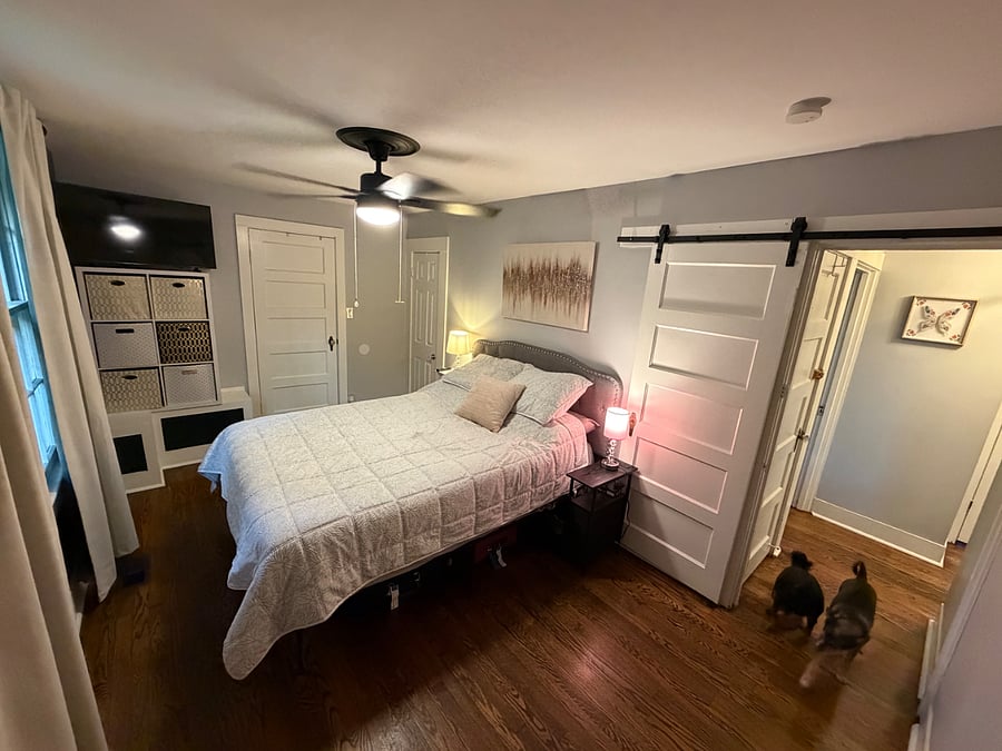 Primary bedroom features queen bed, multiple dressers, walk-in closet, and full bathroom.