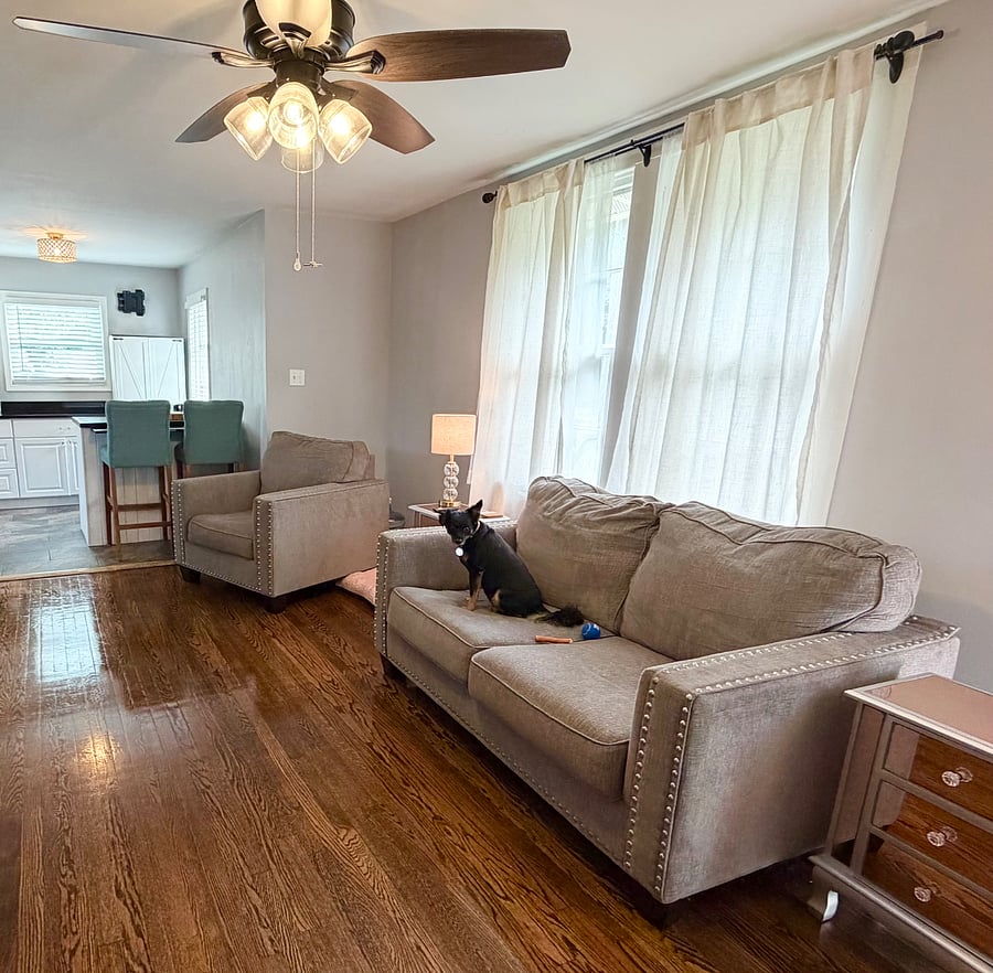 We are pet friendly! Living room features comfy/padded love seat, oversized matching chair, tv, and fireplace.