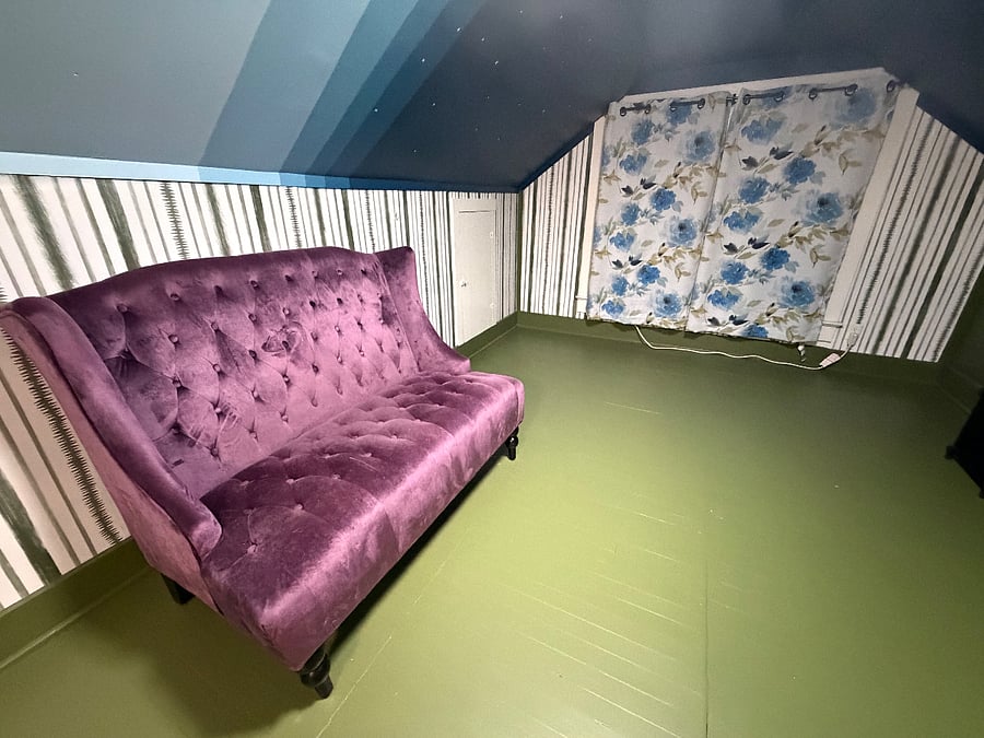 Upstairs/2nd floor living space with modern sofa.