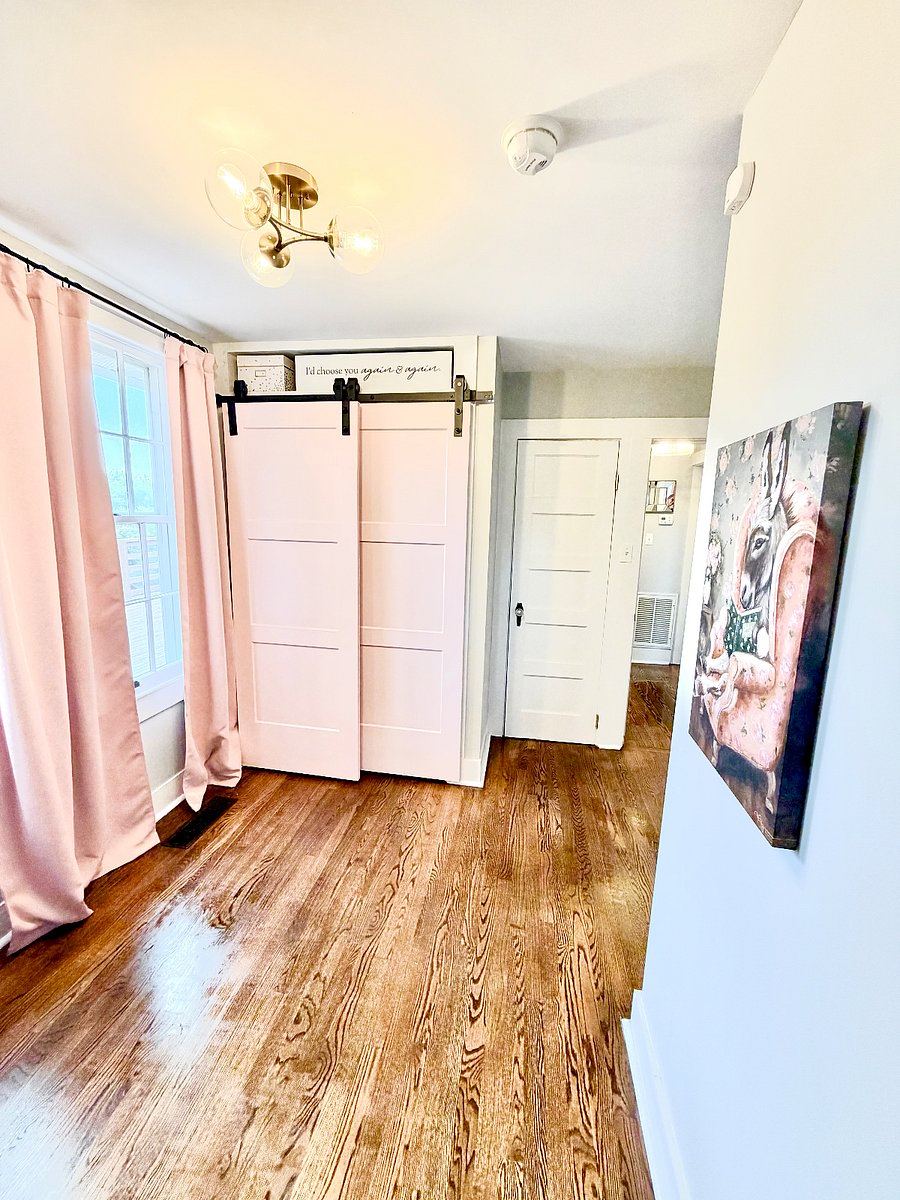 2nd bedroom on 1st floor that also works as an office features 2 closets and overlooks the patio and back yard.