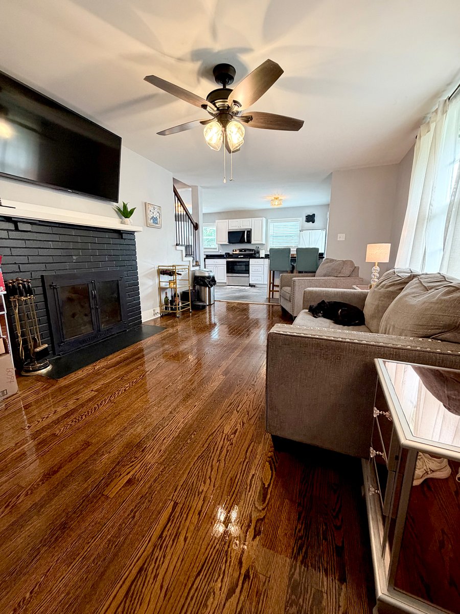 Open concept living room/kitchen with fireplace.
