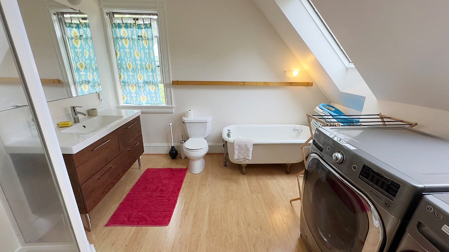 3nd floor bathroom with tub, shower, washer and dryer
